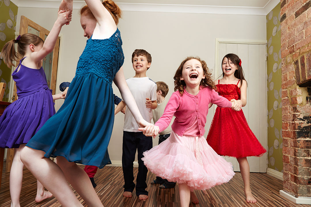 Group of happy children dancing together indoors, enjoying social dancing and building confidence | Learn The Art
